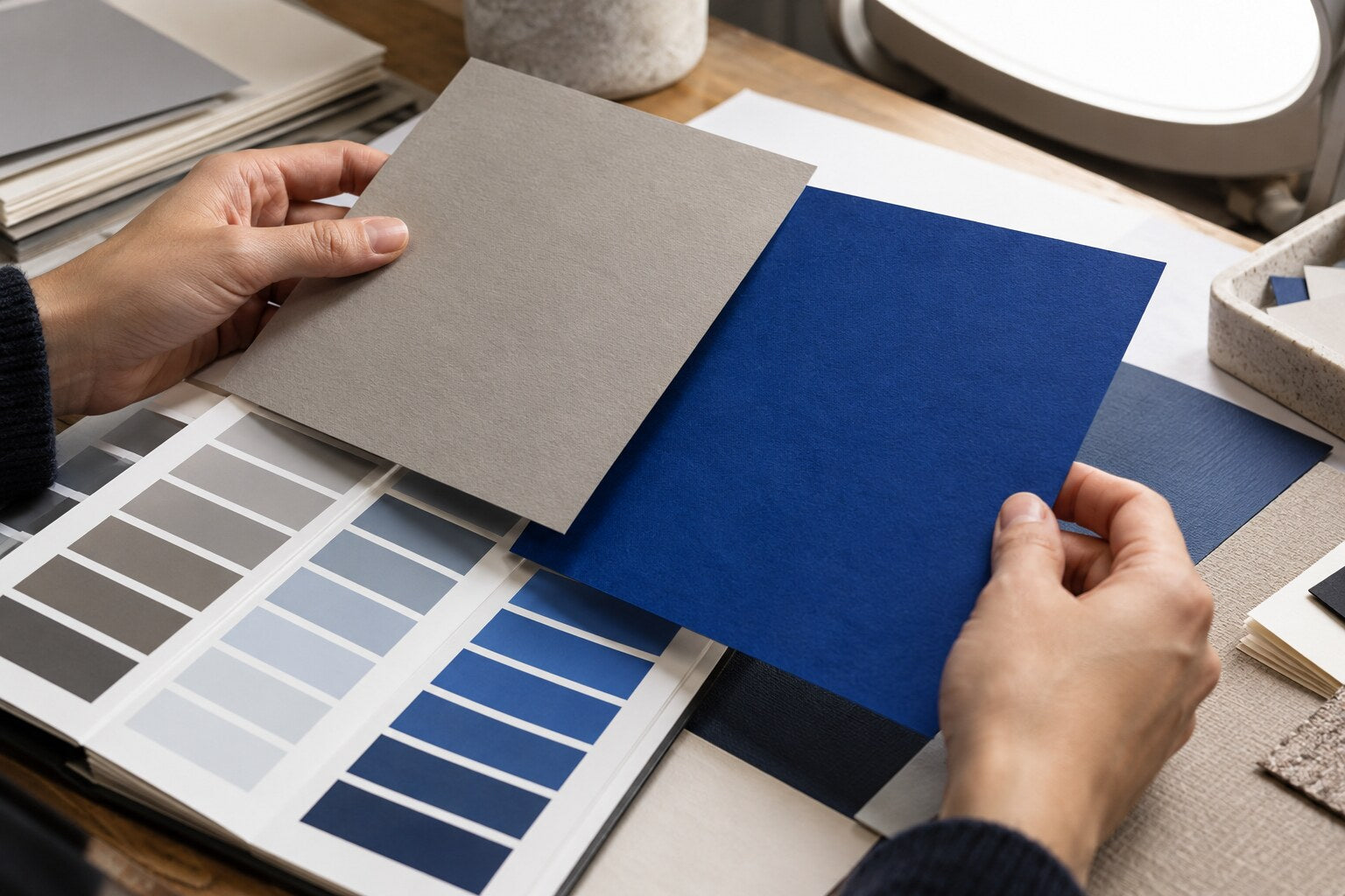 Paper stocks compared against a calibrated color swatch